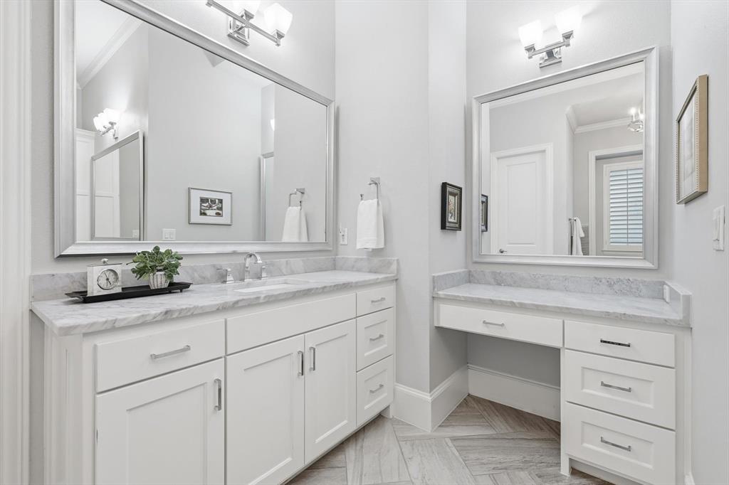 921 Winding Ridge Trail Southlake, TX 76092 - Photo 21 of 40 a bathroom with a sink and a mirror