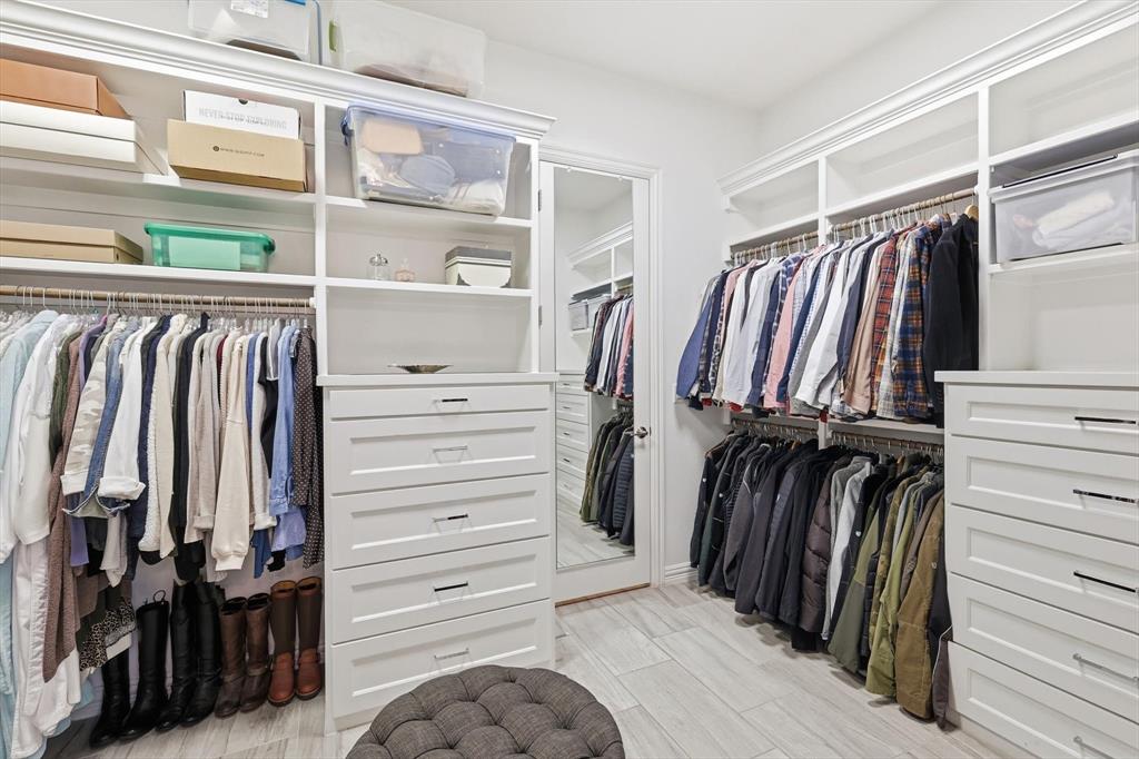921 Winding Ridge Trail Southlake, TX 76092 - Photo 23 of 40 a view of walk in closet with clothes and shoes