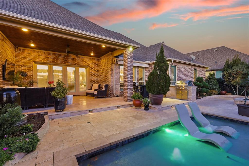 921 Winding Ridge Trail Southlake, TX 76092 - Photo 27 of 40 a view of a house with swimming pool and sitting area