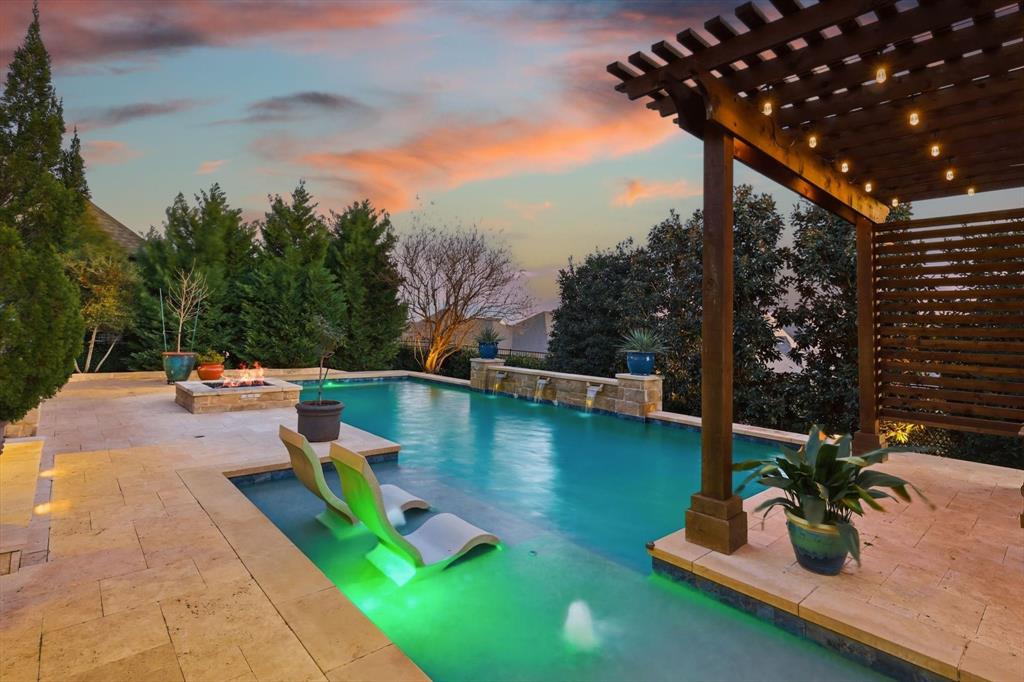 921 Winding Ridge Trail Southlake, TX 76092 - Photo 31 of 40 a view of a swimming pool with a patio