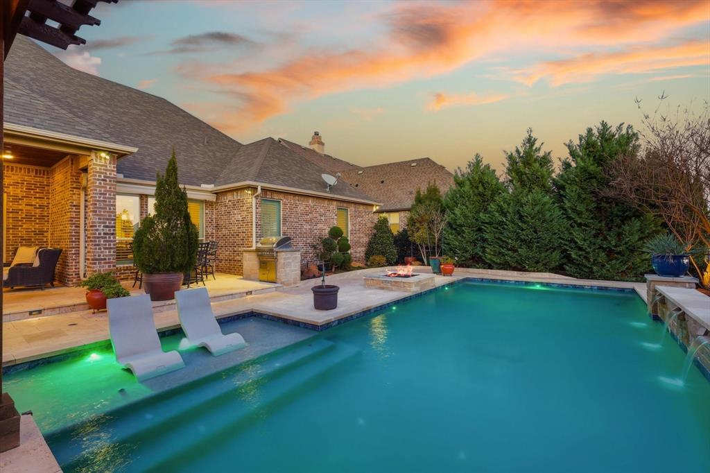 921 Winding Ridge Trail Southlake, TX 76092 - Photo 33 of 40 a view of a patio with couches and table and chairs and potted plants
