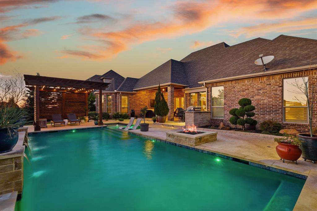 921 Winding Ridge Trail Southlake, TX 76092 - Photo 34 of 40 a view of a house with swimming pool and porch