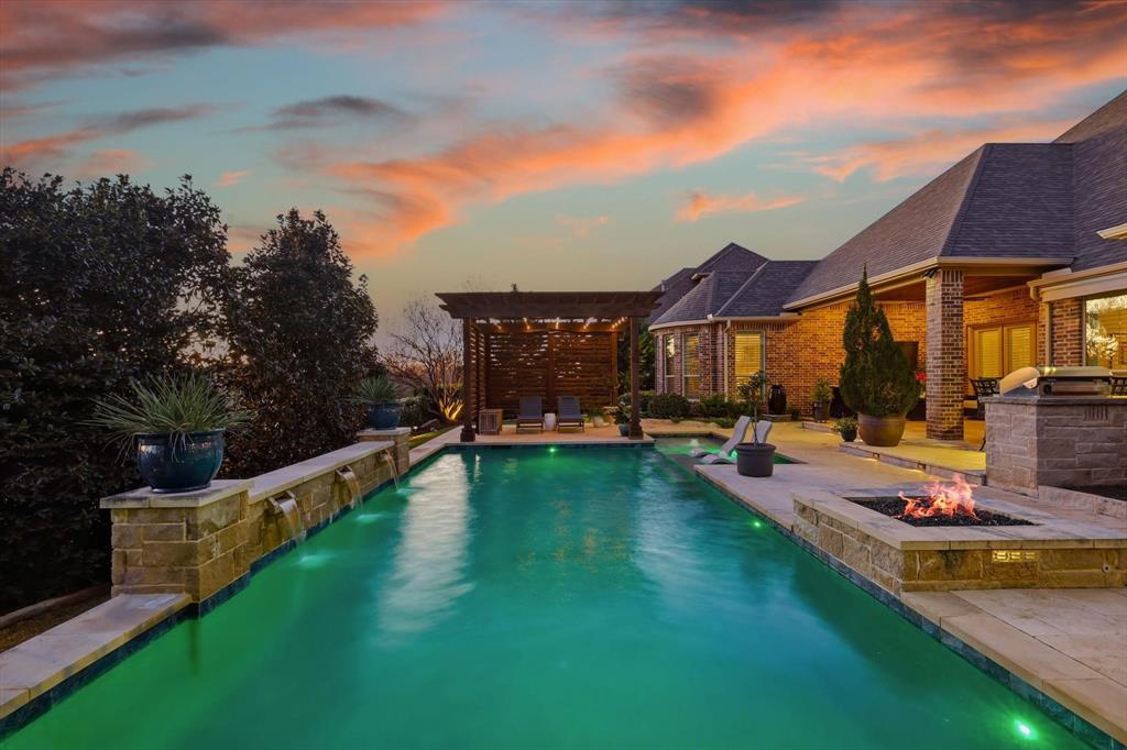 921 Winding Ridge Trail Southlake, TX 76092 - Photo 35 of 40 a view of a house with swimming pool and sitting area