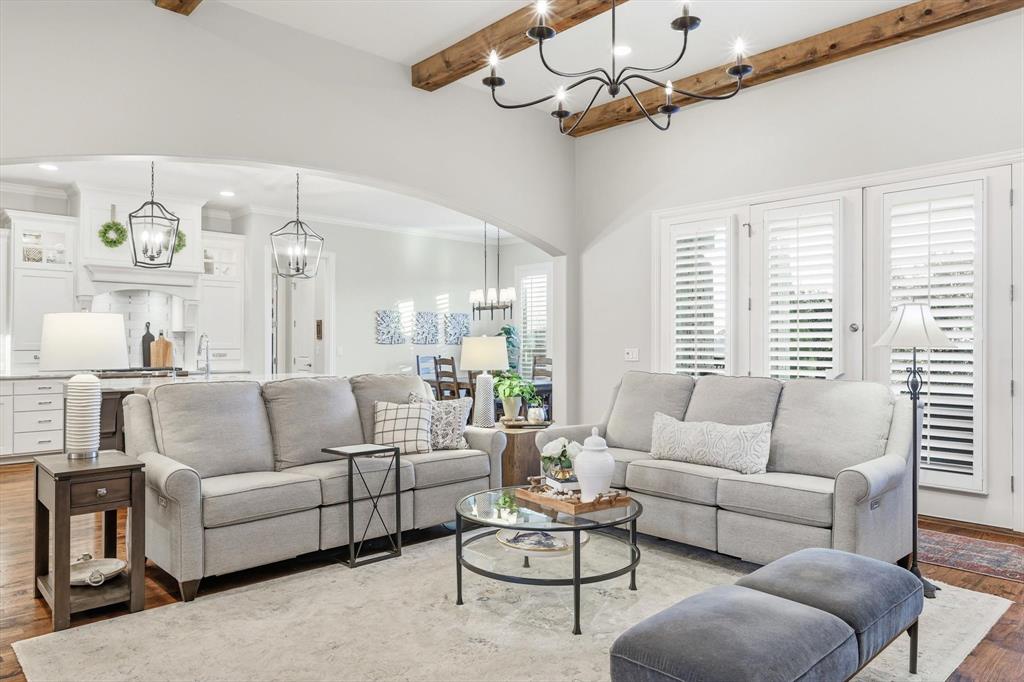 921 Winding Ridge Trail Southlake, TX 76092 - Photo 4 of 40 a living room with furniture a chandelier and a large window