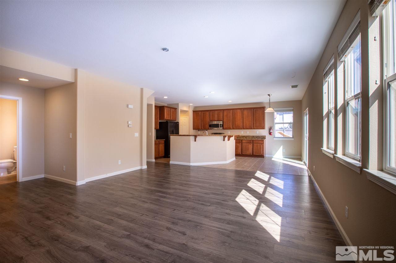 13700 Seabiscuit Drive Reno, NV 89521 - Photo 11 of 27 a living room with furniture wooden floor and a large window