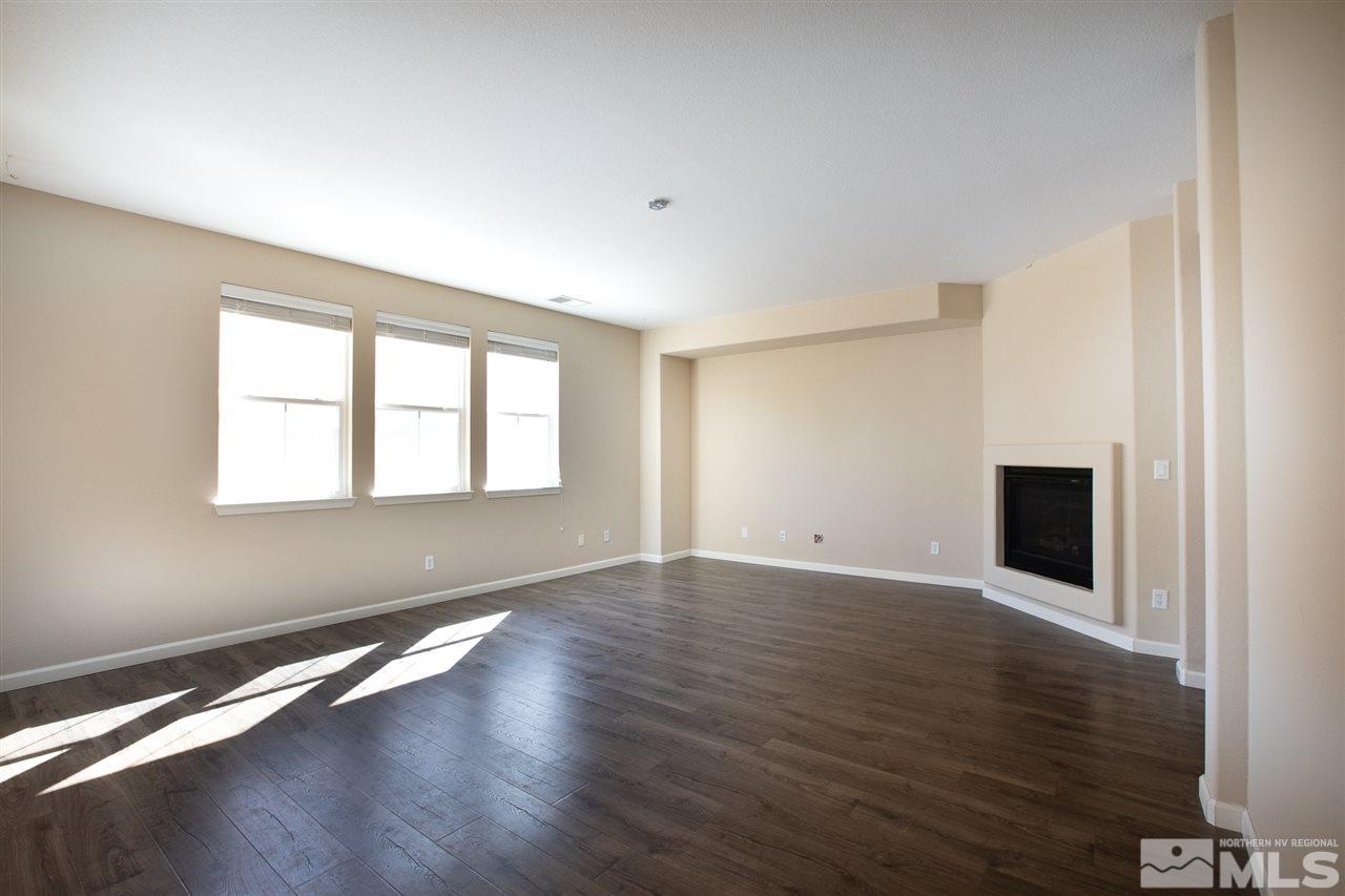 13700 Seabiscuit Drive Reno, NV 89521 - Photo 9 of 27 a view of an empty room with wooden floor and a window
