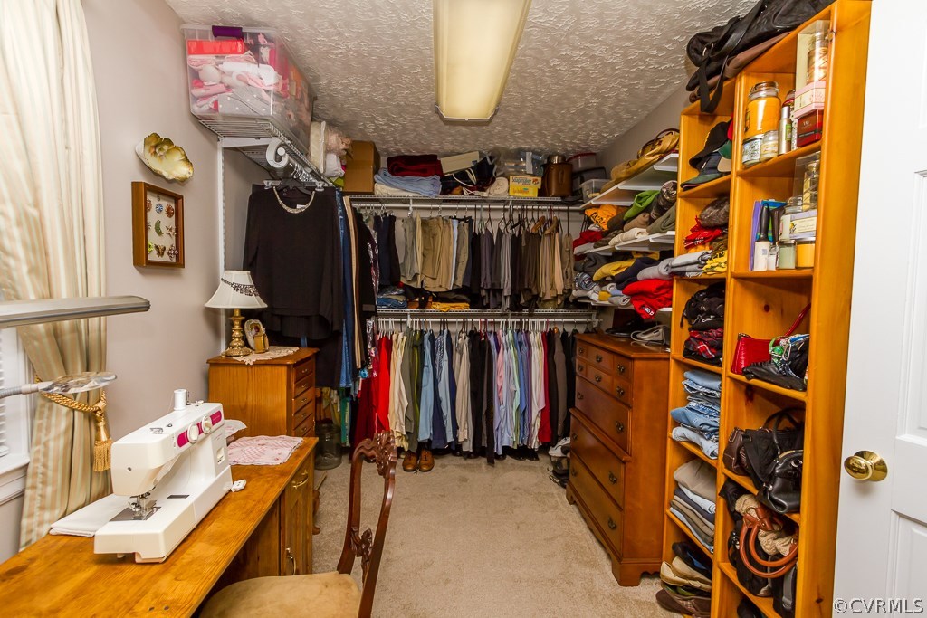 4945 Newbys Bridge Road Chesterfield, VA 23832 - Photo 12 of 22 a view of walk in closet with clothes and shoes