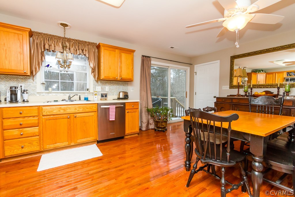 4945 Newbys Bridge Road Chesterfield, VA 23832 - Photo 21 of 22 a kitchen with a sink chairs and window