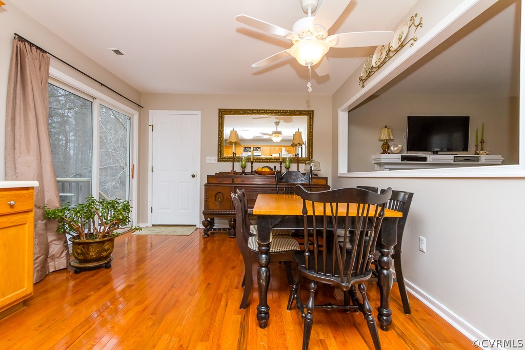 4945 Newbys Bridge Road Chesterfield, VA 23832 - Photo 3 of 22 a view of a dining room with furniture window and wooden floor
