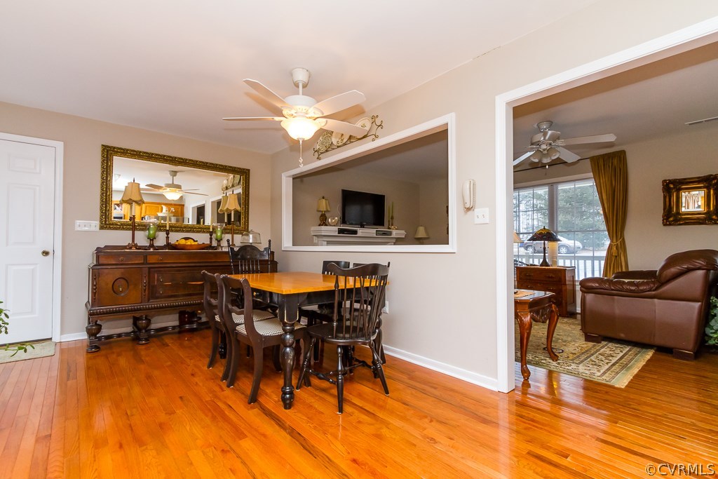 4945 Newbys Bridge Road Chesterfield, VA 23832 - Photo 5 of 22 a view of a dining room with furniture window and wooden floor