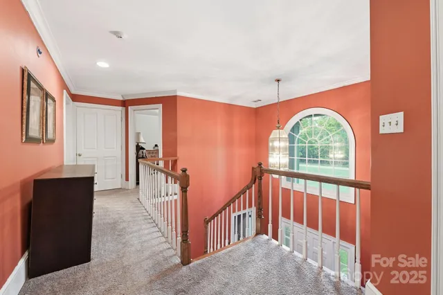 en empty room with window and ceiling fan