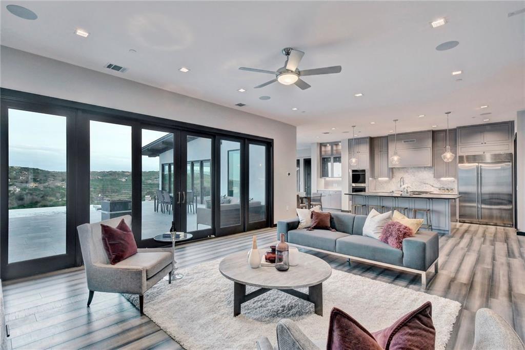 600 Barrett Lane Austin, TX 78733 - Photo 13 of 35 a living room with furniture and a large window