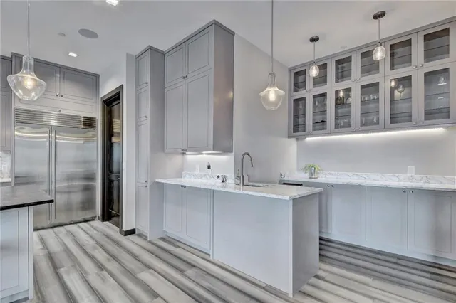 a kitchen with a sink and refrigerator