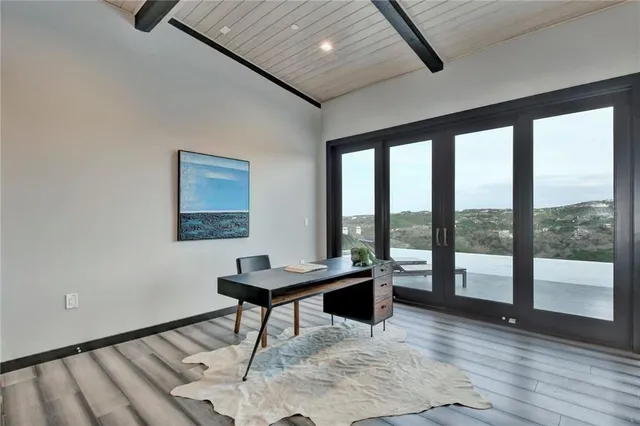 a workspace with furniture and a window