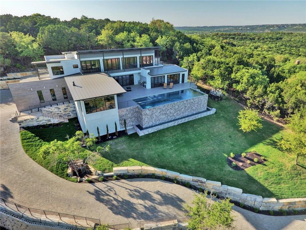 600 Barrett Lane Austin, TX 78733 - Photo 2 of 35 a front view of a house with a yard
