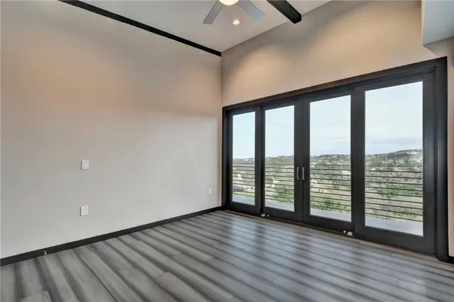 wooden floor in an empty room with a window