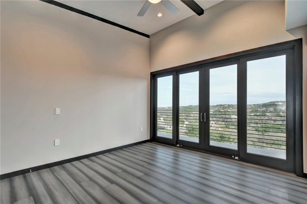 600 Barrett Lane Austin, TX 78733 - Photo 21 of 35 wooden floor in an empty room with a window