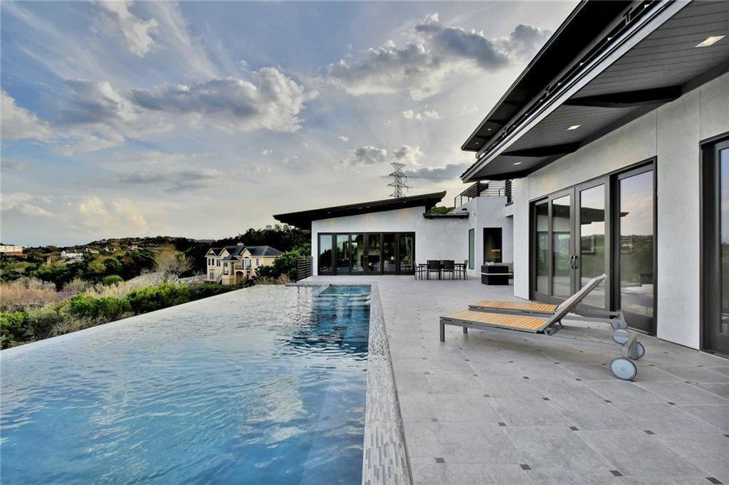 600 Barrett Lane Austin, TX 78733 - Photo 28 of 35 a view of a swimming pool with a patio