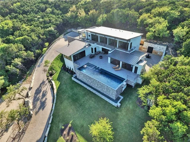 an aerial view of a house with a garden