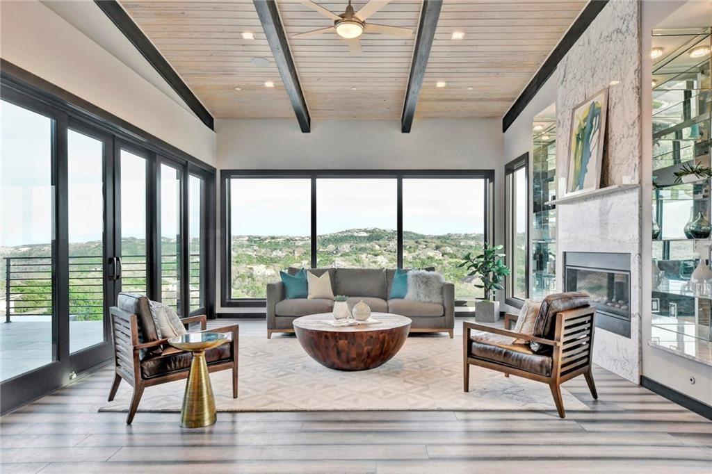 600 Barrett Lane Austin, TX 78733 - Photo 4 of 35 a view of a patio with couches chairs dining table and chairs