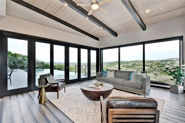 a living room with furniture and a large window