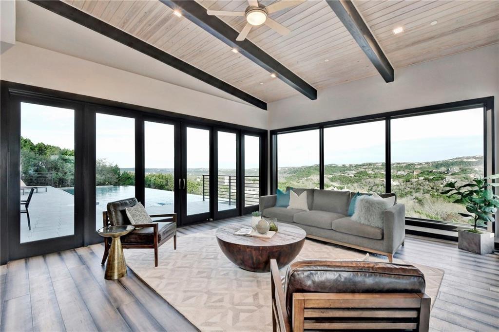 600 Barrett Lane Austin, TX 78733 - Photo 6 of 35 a living room with furniture and a large window