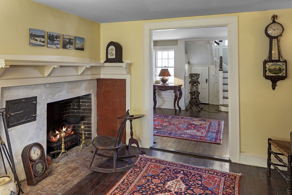 75 Bridge Street Manchester, MA 01944 - Photo 12 of 23 a living room with furniture and a fireplace