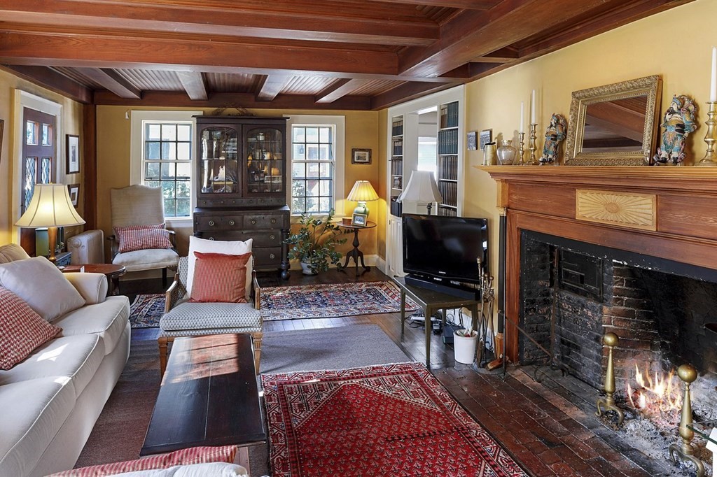 75 Bridge Street Manchester, MA 01944 - Photo 15 of 23 a living room with furniture and a fireplace