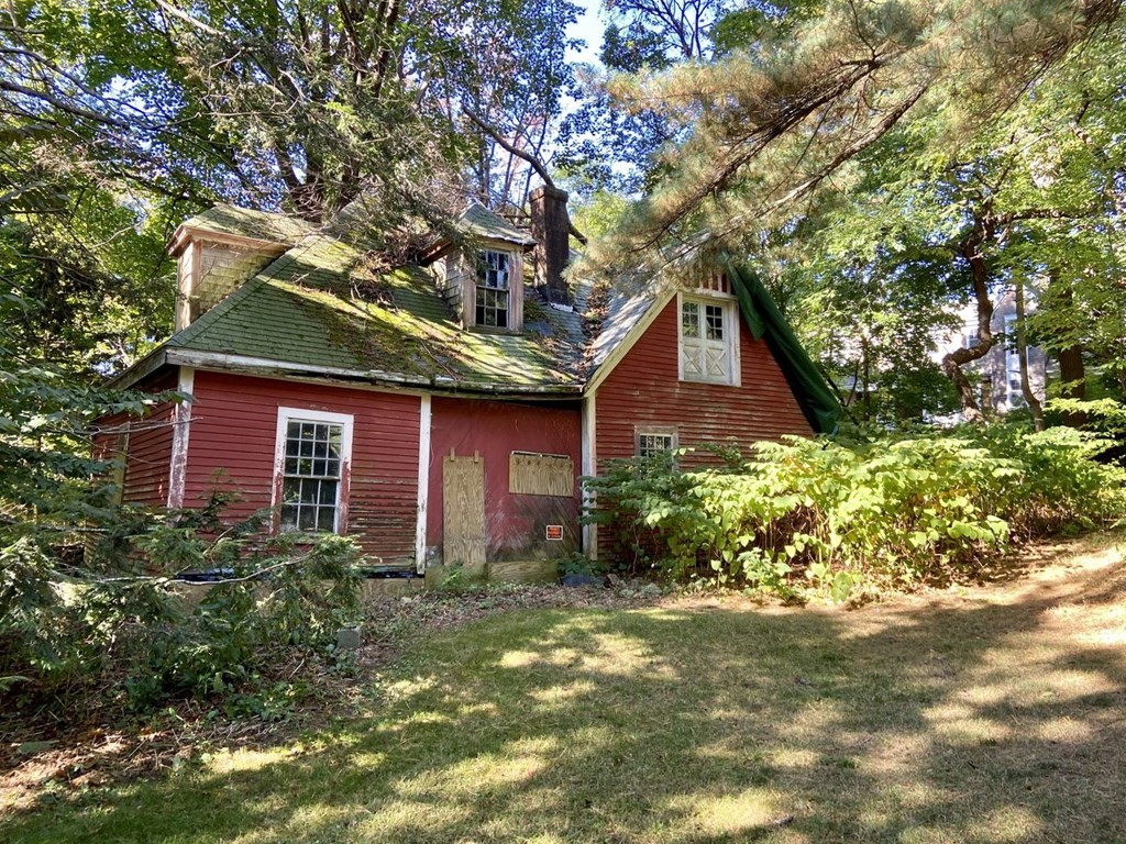75 Bridge Street Manchester, MA 01944 - Photo 22 of 23 a front view of a house with garden