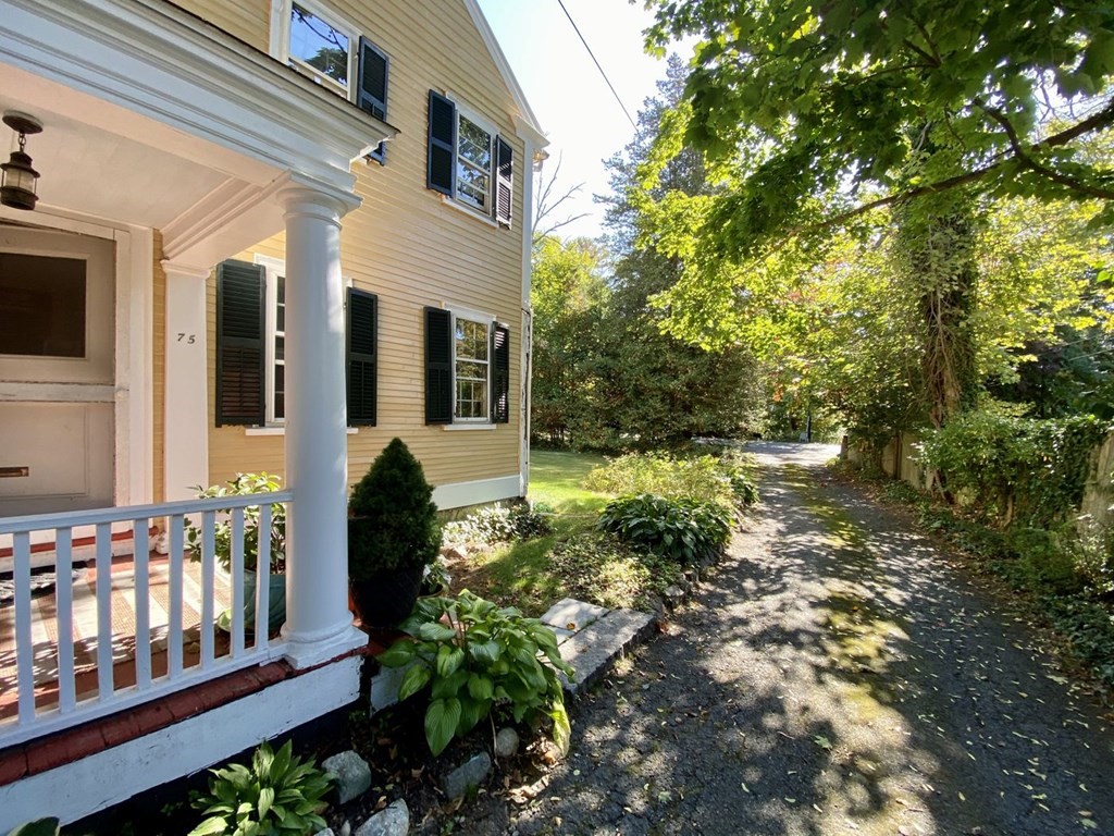 75 Bridge Street Manchester, MA 01944 - Photo 4 of 23 a view of a house with balcony