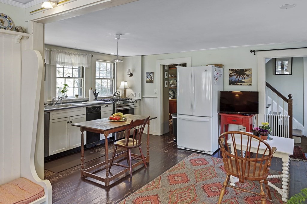 75 Bridge Street Manchester, MA 01944 - Photo 7 of 23 a work room with furniture a flat screen tv and a window