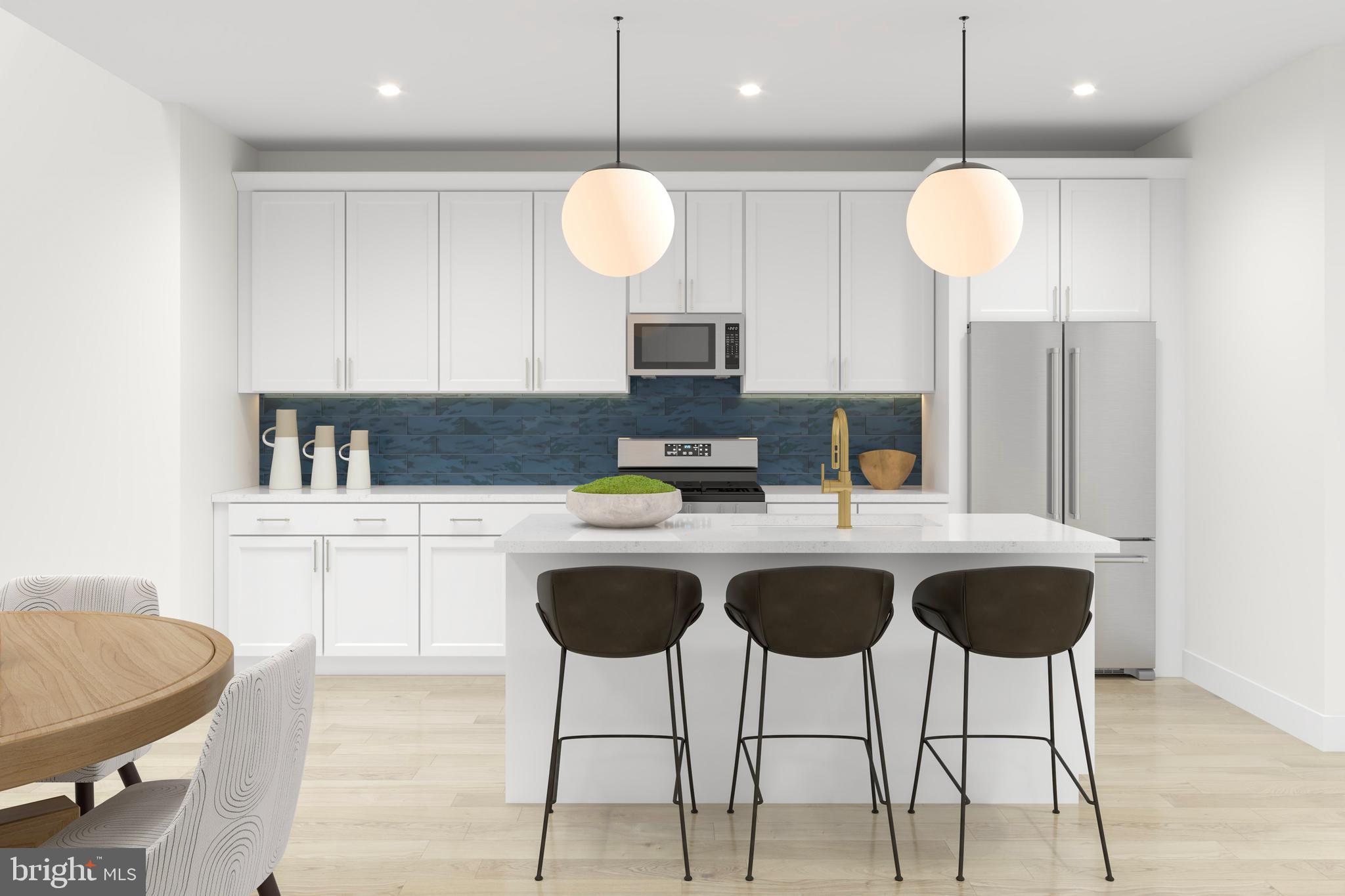 18201 Donatello Drive, Unit 1812 Princeton, NJ 08540 - Photo 3 of 13 a kitchen with a dining table cabinets and stainless steel appliances