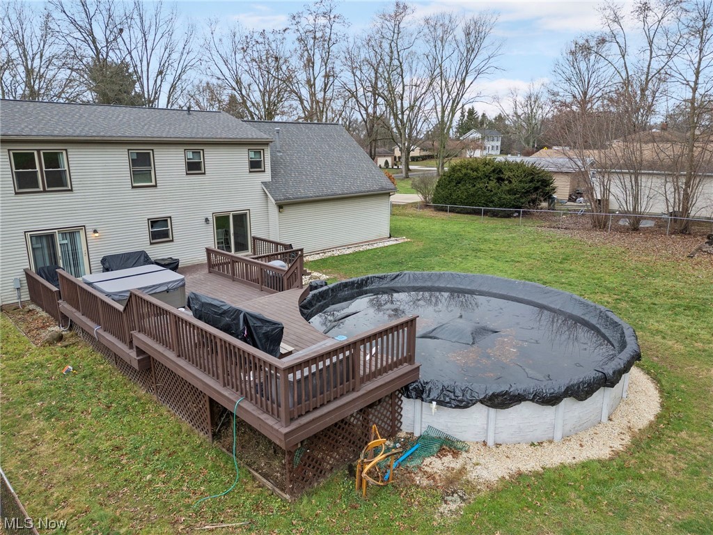 4915 Monticello Street Northwest Canton, OH 44708 - Photo 30 of 31 View of yard featuring a double-tiered deck and above ground pool