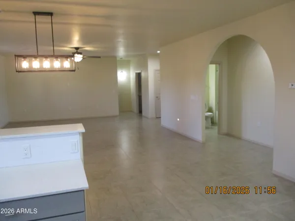 a view of an empty room with windows