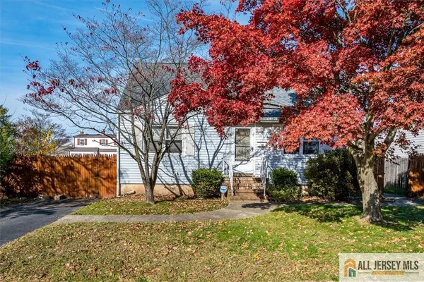 a backyard of a house with large trees
