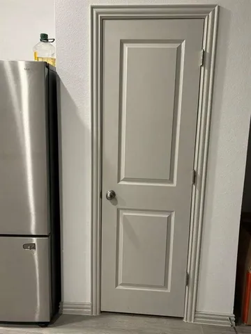 a view of a refrigerator in kitchen