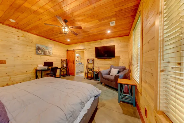 a view of walk in closet with clothes