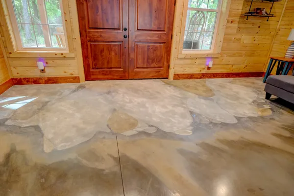 a view of a livingroom with furniture and staircase