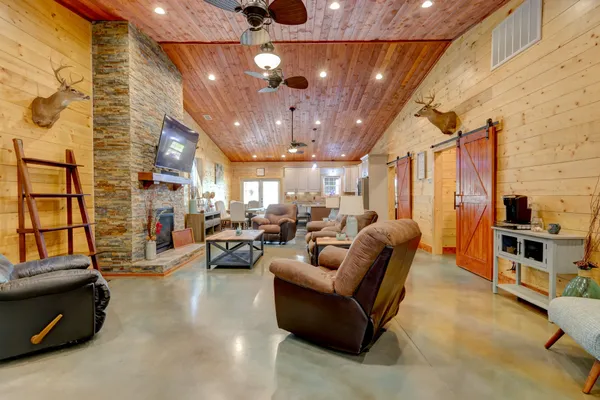 a living room with furniture and a flat screen tv