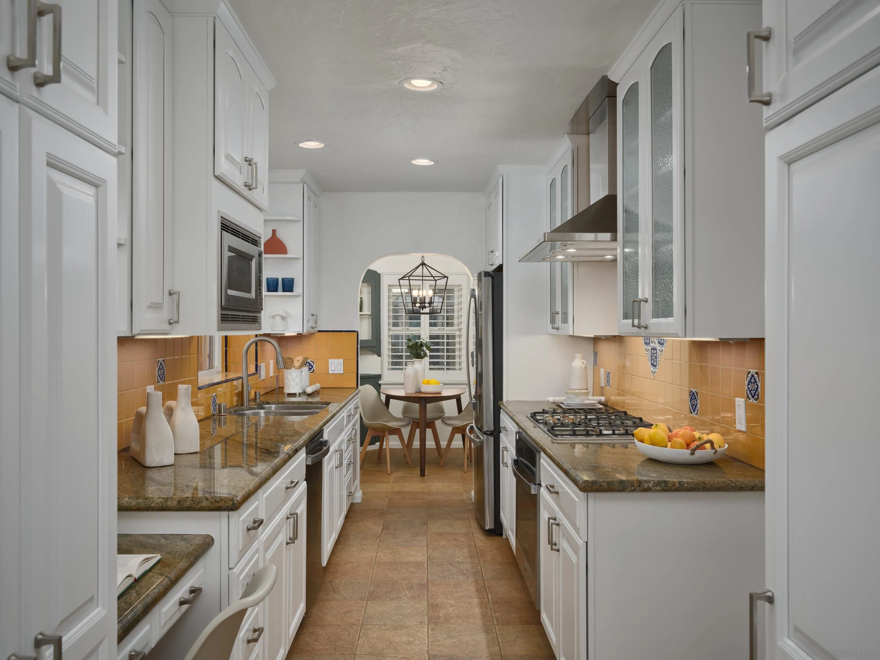 4725 Natalie Drive San Diego, CA 92115 - Photo 15 of 34 a kitchen with stainless steel appliances granite countertop a stove and a sink