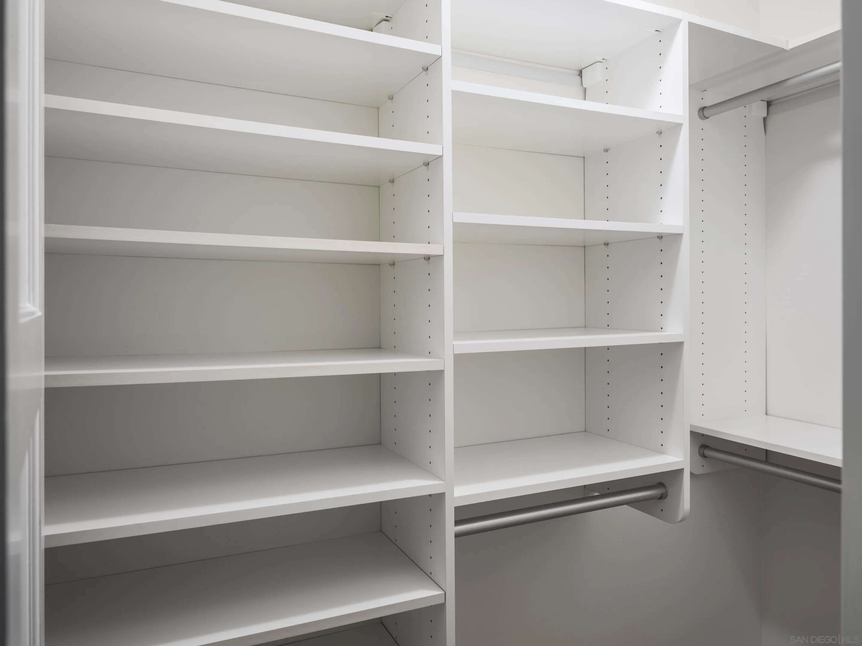 4725 Natalie Drive San Diego, CA 92115 - Photo 23 of 34 a view of walk in closet with empty racks