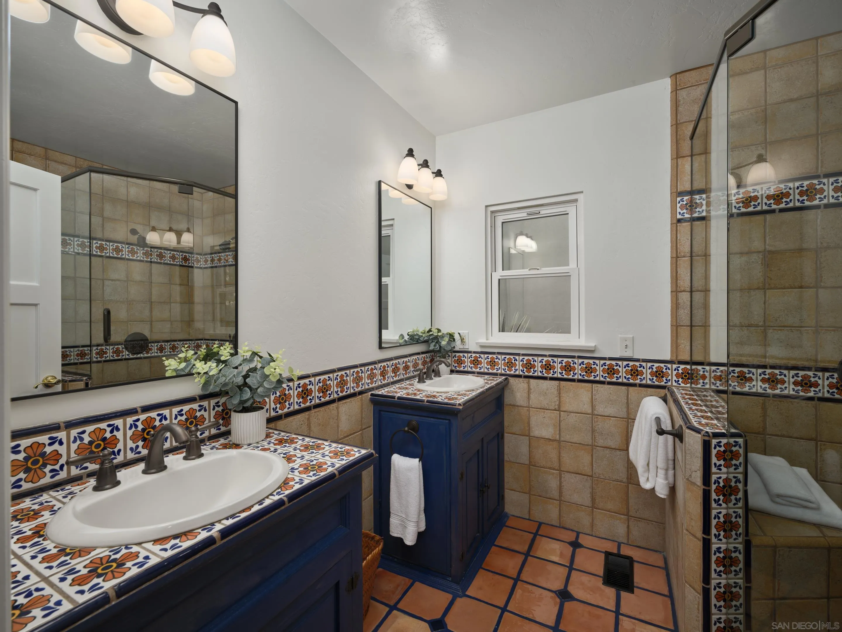 4725 Natalie Drive San Diego, CA 92115 - Photo 25 of 34 a bathroom with a sink and a mirror