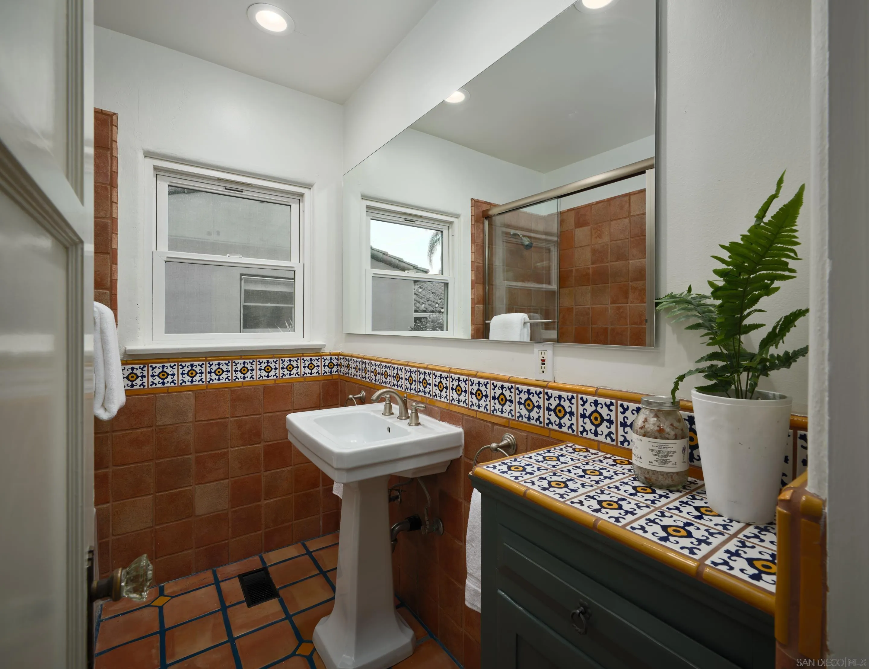 4725 Natalie Drive San Diego, CA 92115 - Photo 28 of 34 a view of a bathroom with a sink and a mirror