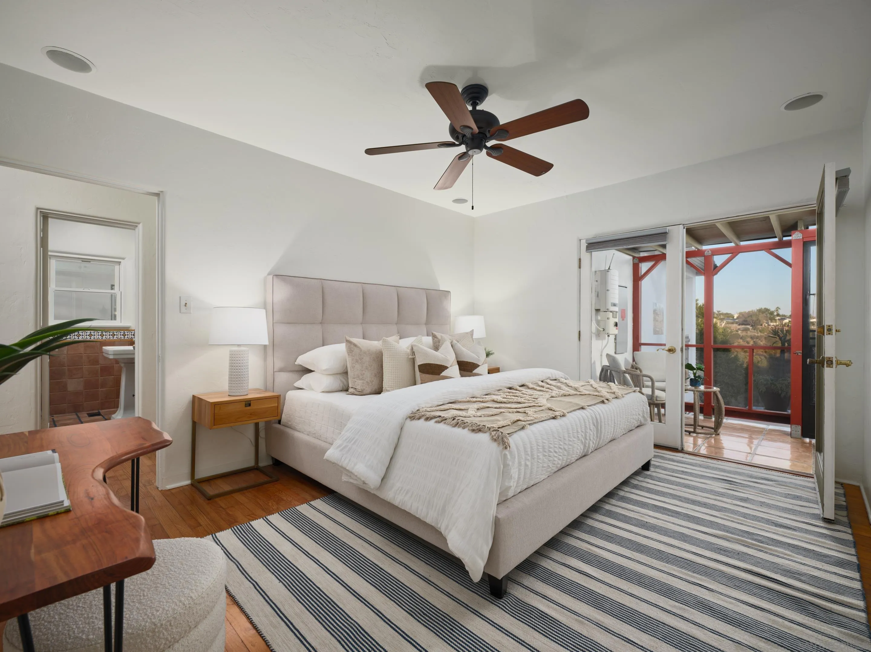 4725 Natalie Drive San Diego, CA 92115 - Photo 29 of 34 a bedroom with a bed a couch and a window