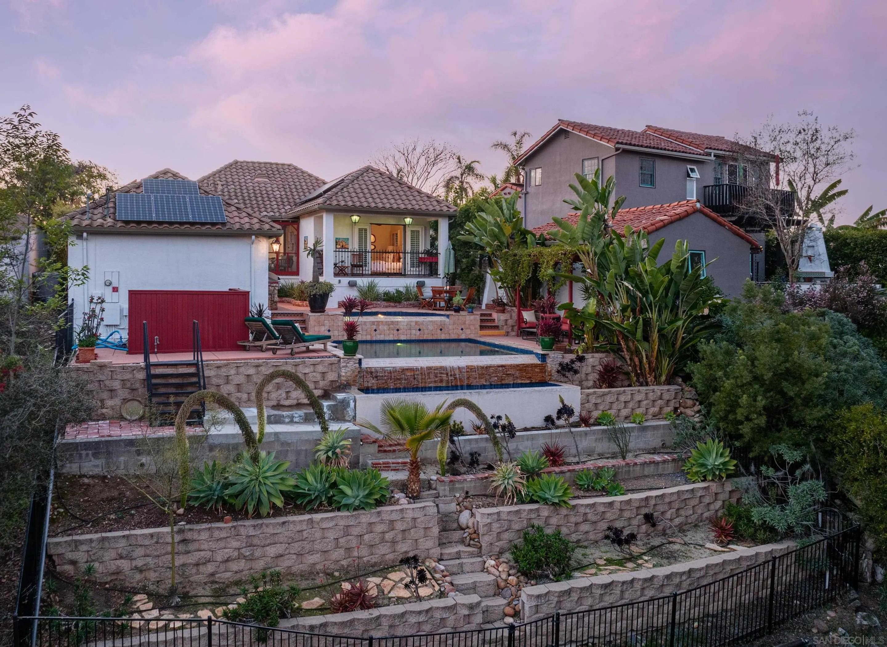 4725 Natalie Drive San Diego, CA 92115 - Photo 5 of 34 a front view of a house with garden