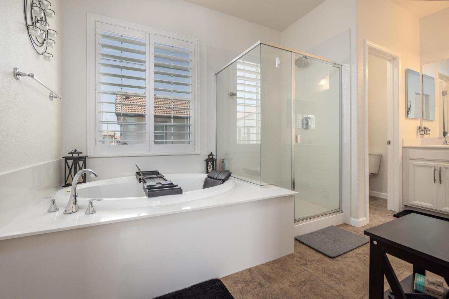 7708 Sumac Place Gilroy, CA 95020 - Photo 18 of 26 a bathroom with a sink and a mirror