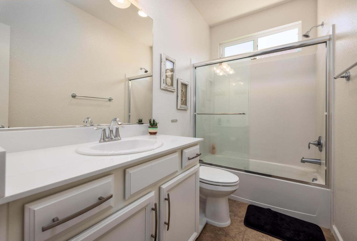 7708 Sumac Place Gilroy, CA 95020 - Photo 20 of 26 a bathroom with a sink a toilet and shower