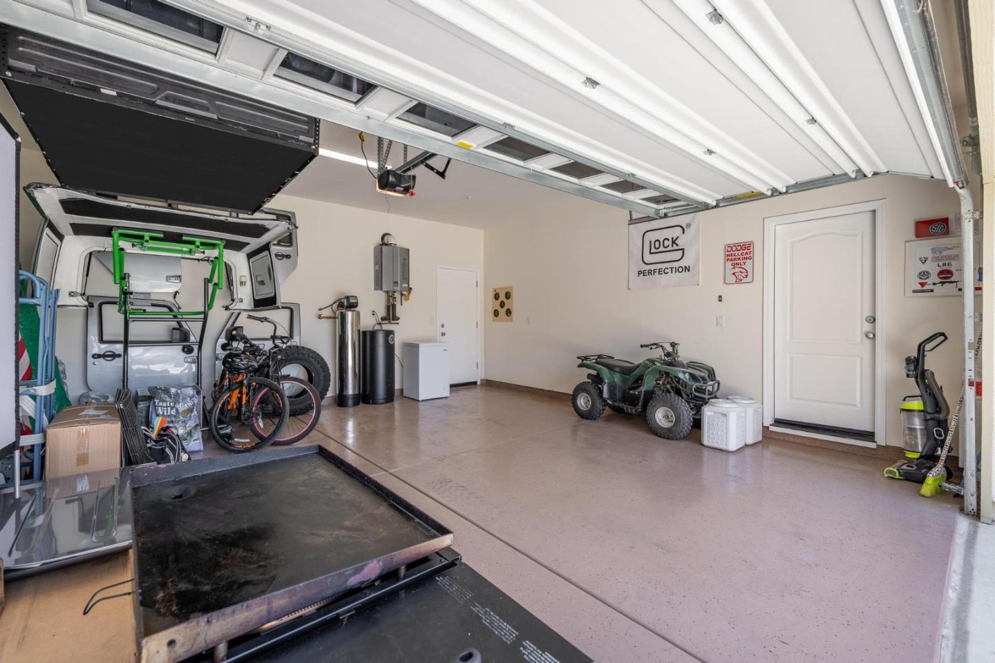 7708 Sumac Place Gilroy, CA 95020 - Photo 21 of 26 a view of a garage with a bike and car