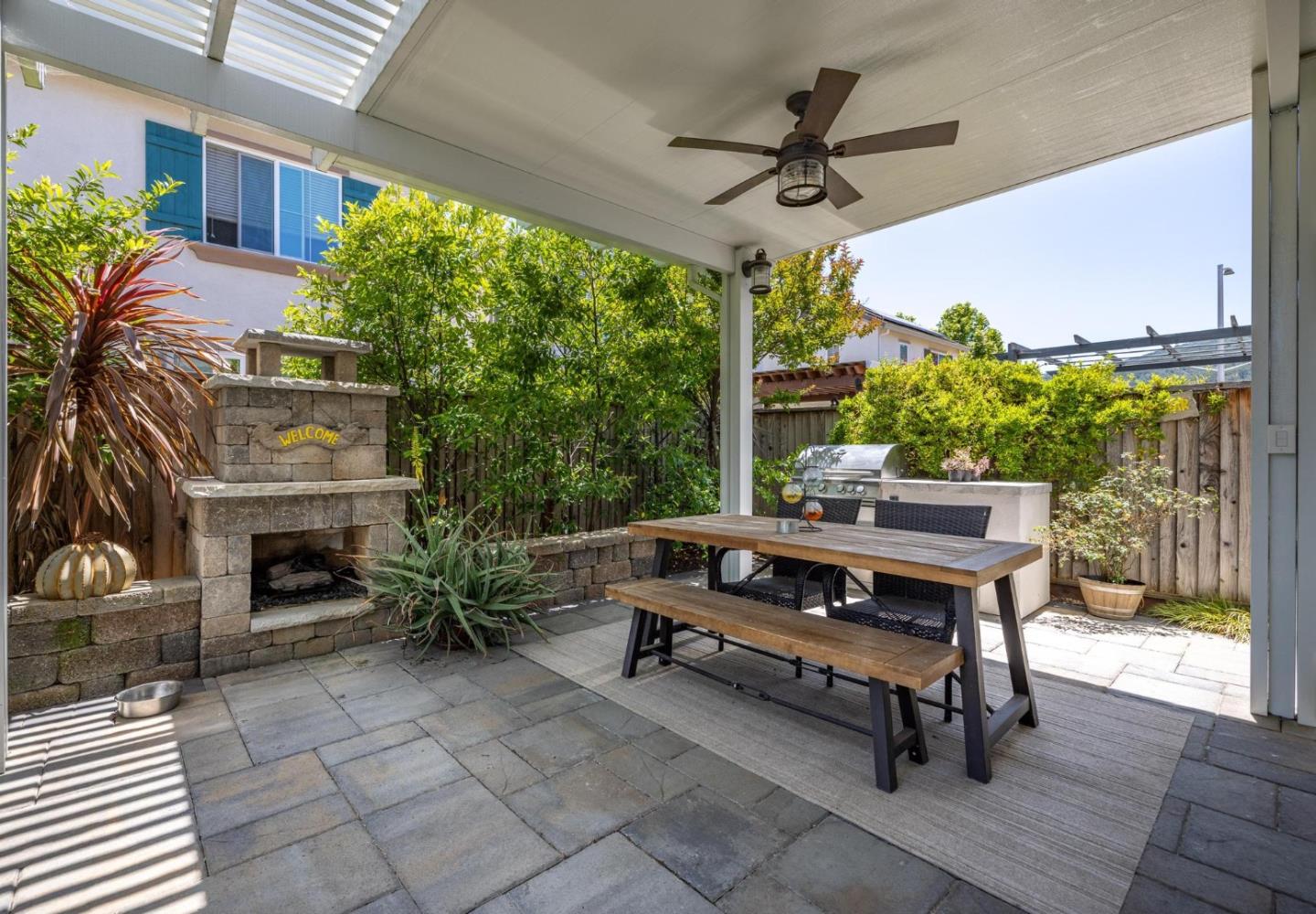 7708 Sumac Place Gilroy, CA 95020 - Photo 22 of 26 a living room with patio furniture and a fireplace