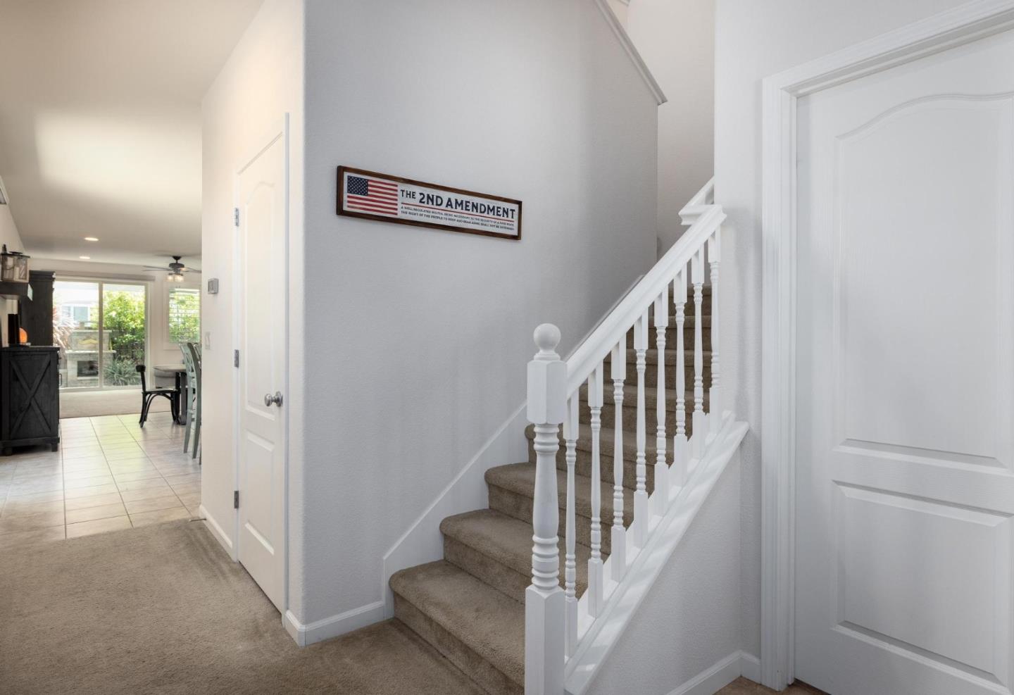 7708 Sumac Place Gilroy, CA 95020 - Photo 4 of 26 a view of a hallway with wooden floor and staircase